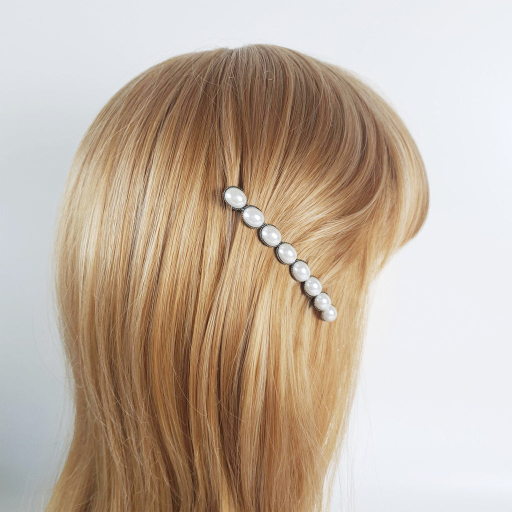 Vintage style antique brass French barrette featuring a row of four glossy oval acetate stones. 3.1 inch retro hair clip for half-up and side hair styling.