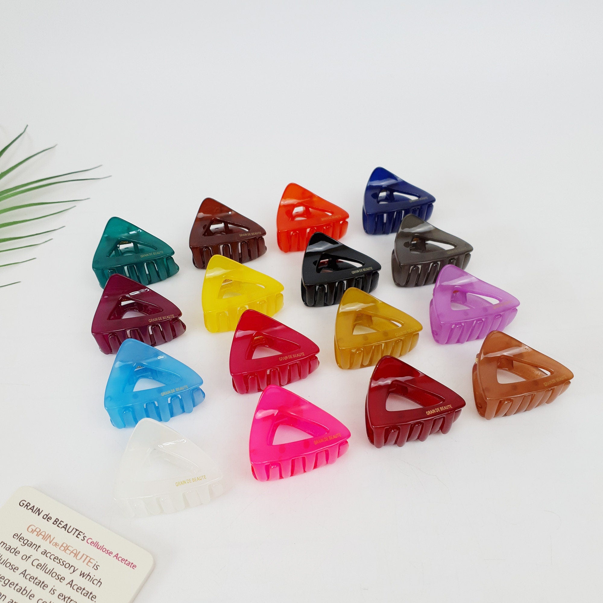 Small triangle hair claw clips in 16 vibrant colors made of cellulose acetate. 1.8 inch glossy geometric jaw clips for bangs and half-up styles.