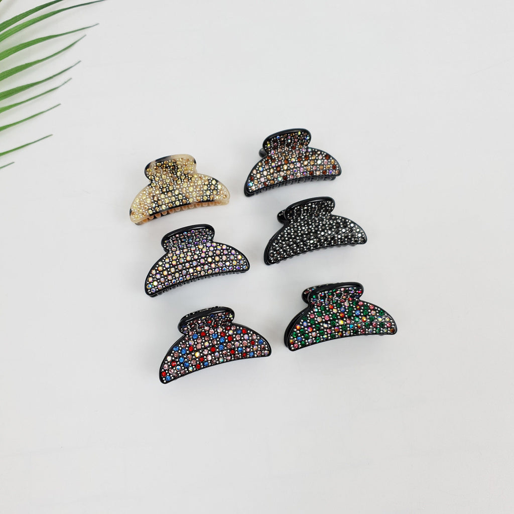 Small half-moon cellulose acetate hair claw clip embellished with sparkling cubic zirconia crystals. 1.8 inch mini jaw clip with double inner teeth for secure grip.