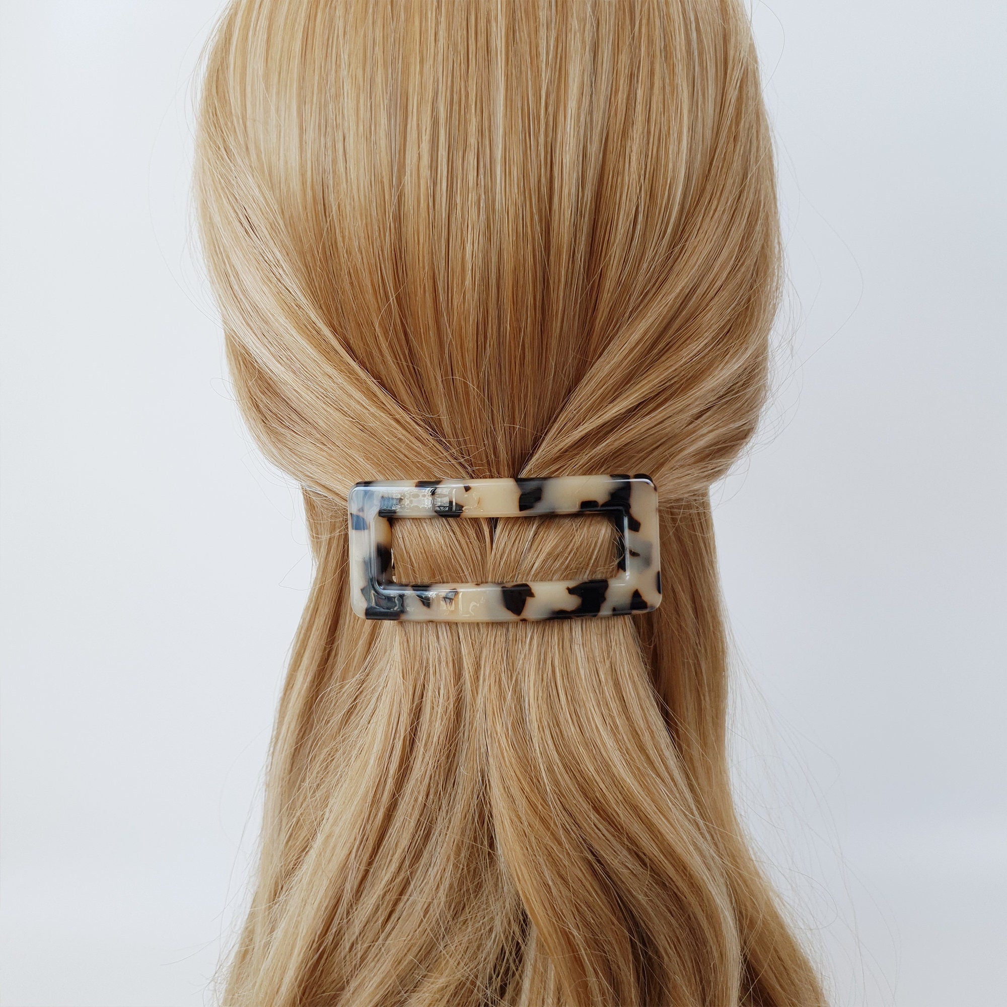 Cellulose acetate rectangular buckle hair barrette in tortoise shell and marble patterns. Medium size automatic clip for half up hairstyles.
