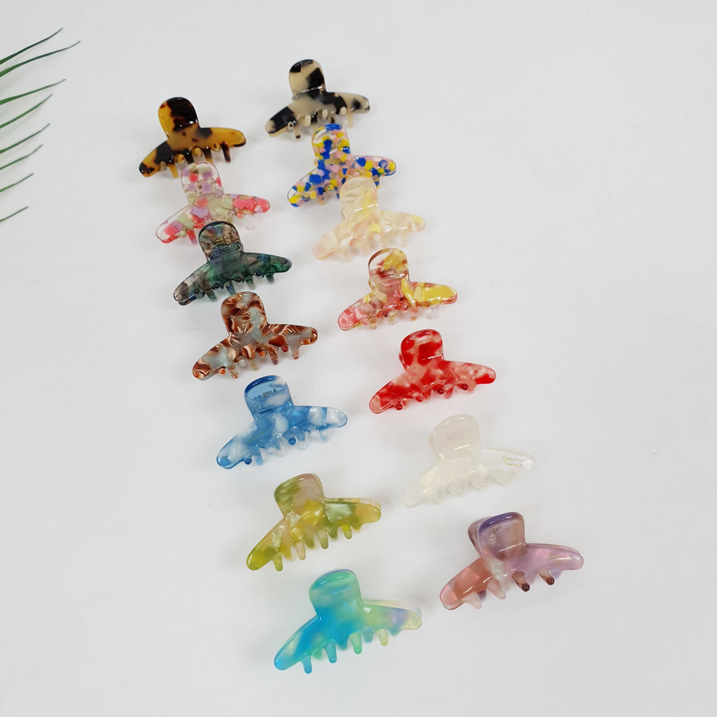 Cellulose acetate mini hair claw clip in tortoise and marble patterns. Small side hair clip for bangs styling and half up accents.