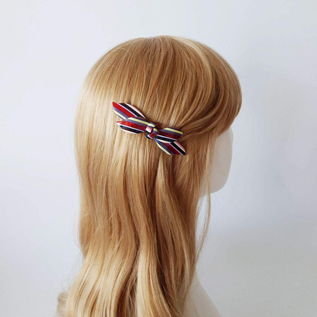 Cellulose acetate double ribbon barrette with wave design. 3.7 inch automatic clip in colorful marble and tortoise patterns for side hair.