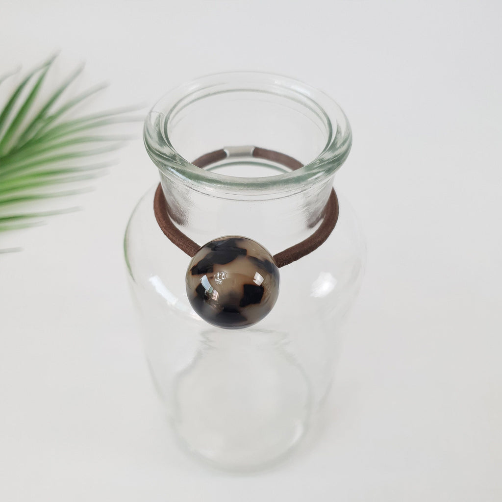 Glossy cellulose acetate hair ties in cube and ball shapes. Geometric ponytail holder in tortoise shell and marble. Minimalist Korean fashion accessory for women birthday gift.