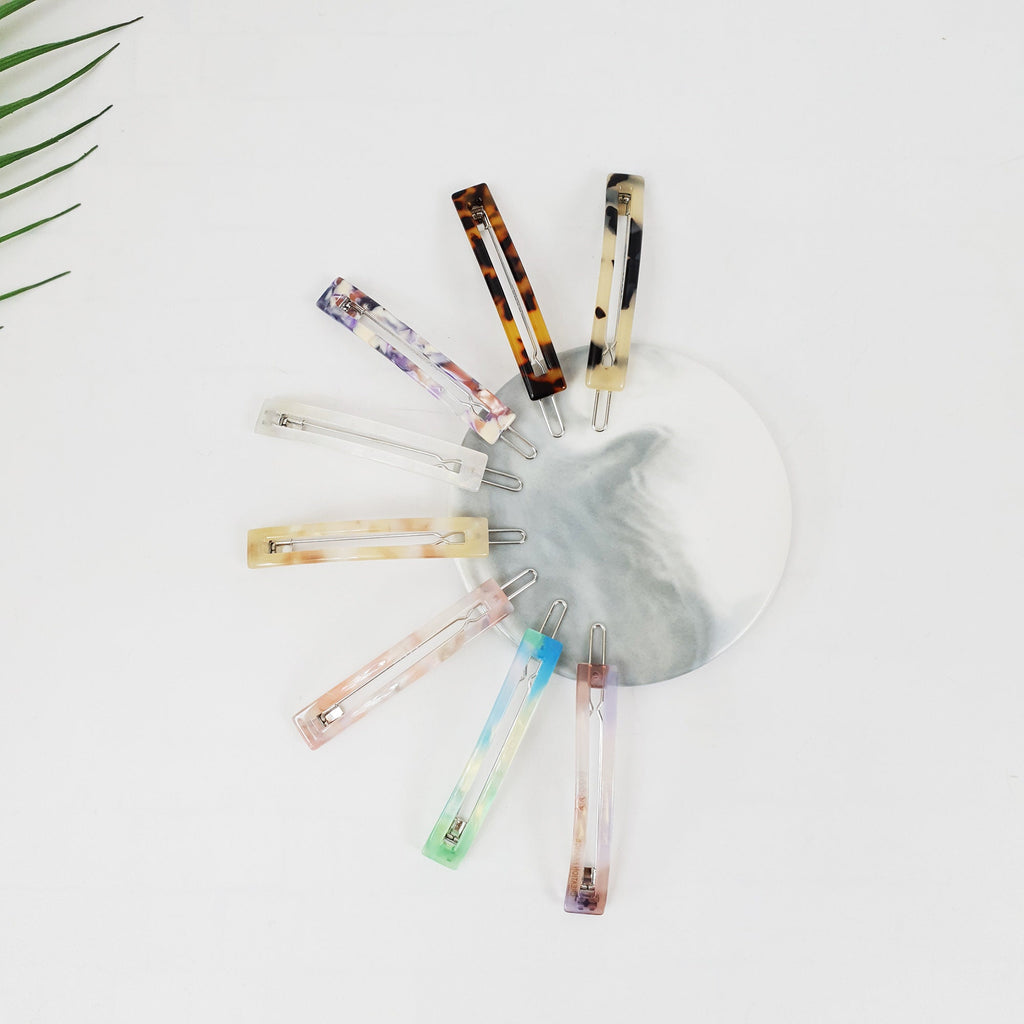 Rectangular cellulose acetate hair pin in tortoise shell and marble patterns. Minimalist slide clip for bangs and side hair.