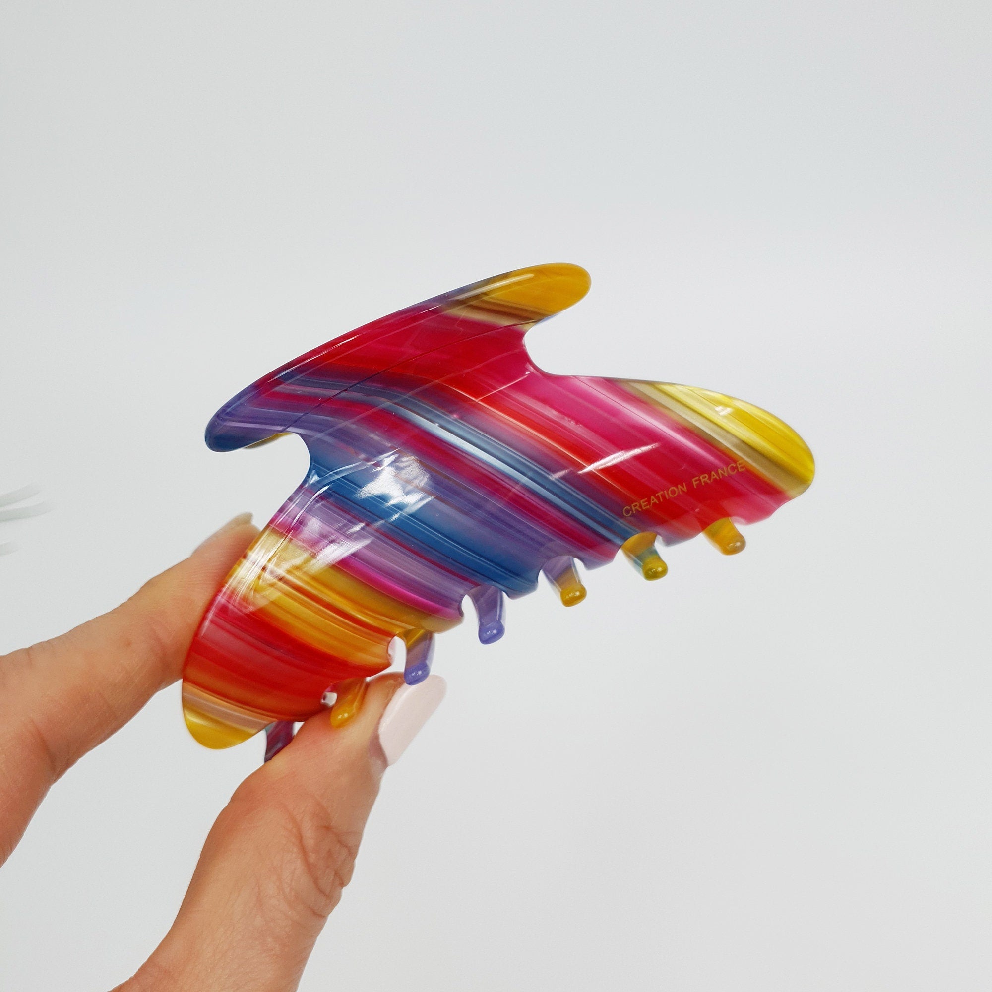 Cellulose acetate half moon hair claw in tortoise and aurora patterns. 3.7 inch medium jaw clip for half up hairstyles and thick hair.