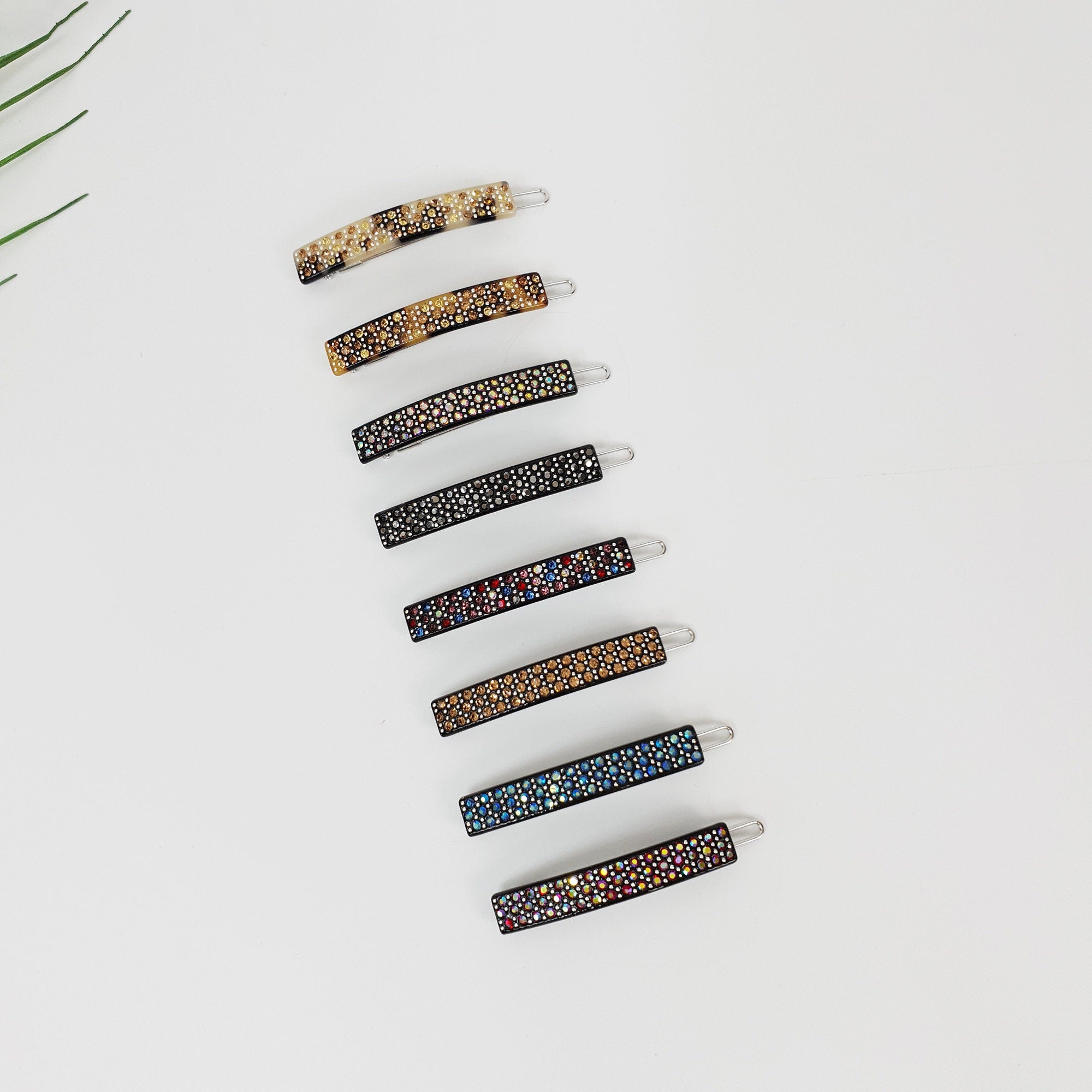 Cellulose acetate rectangular snap hair clip with rhinestone crystals. Small 2 inch barrette for bangs in black and tortoise shell.