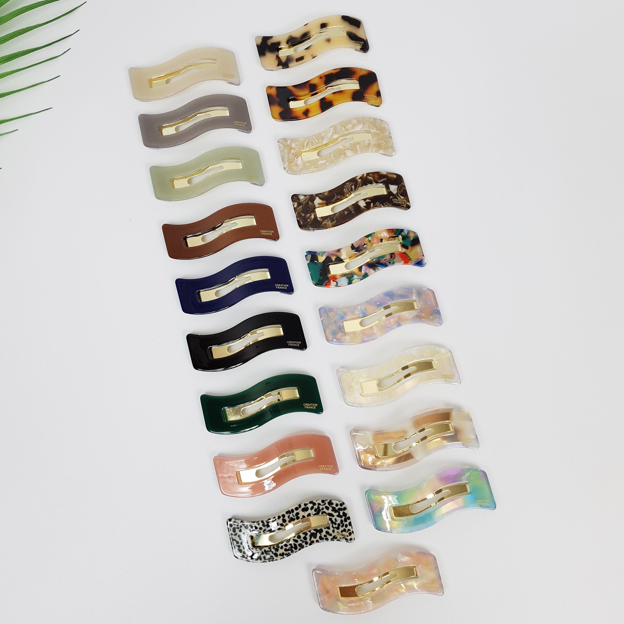 Cellulose acetate wavy rectangle snap hair clip in tortoise shell and pastel colors. Minimalist 2.6 inch geometric barrette for side bangs and flyaways.