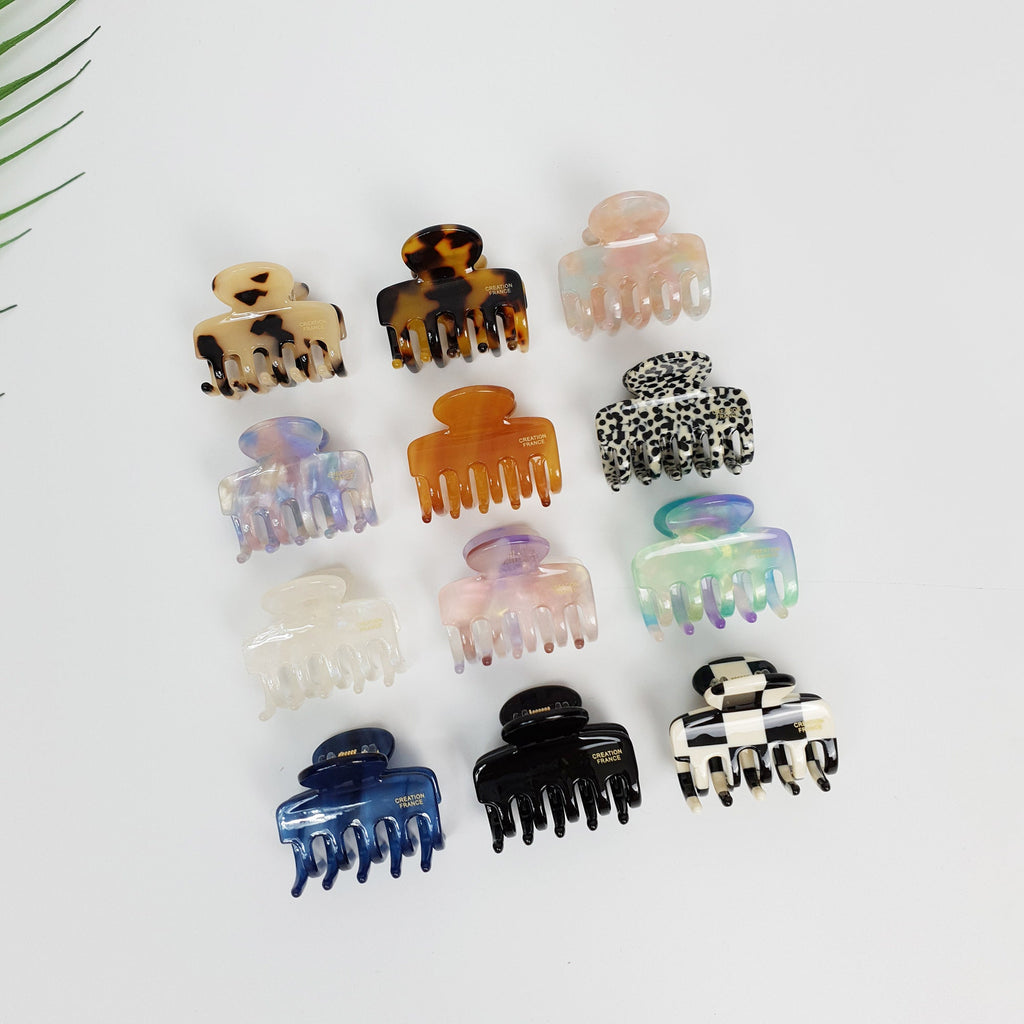Small cellulose acetate hook hair claw clip in checkerboard and tortoise patterns. Mini jaw clip for half up hairstyles.
