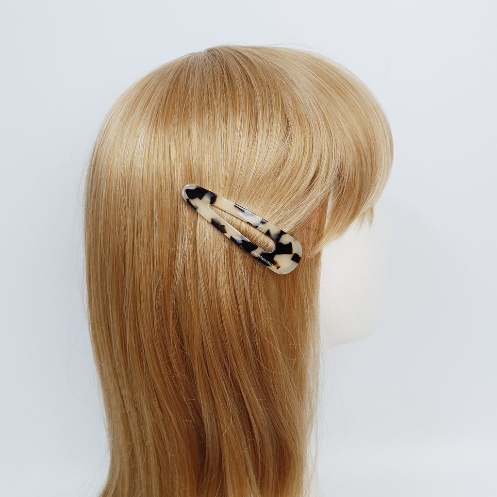 Cellulose acetate triangle snap hair clip in tortoise shell and aurora patterns. Medium sized 3 inch geometric barrette for styling side bangs or loose hair.