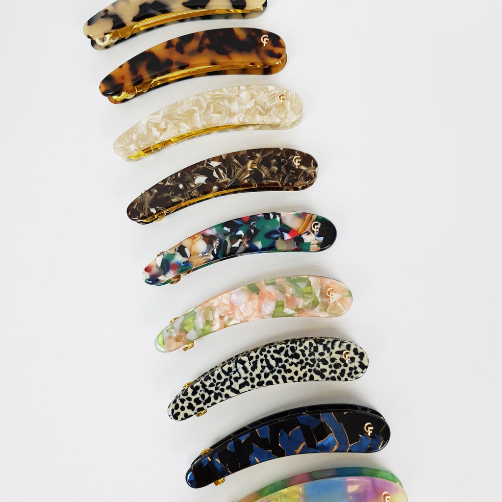 Cellulose acetate long slim curved automatic hair clip in tortoise shell and marble patterns. 3.5 inch ponytail holder for half up hairstyles.