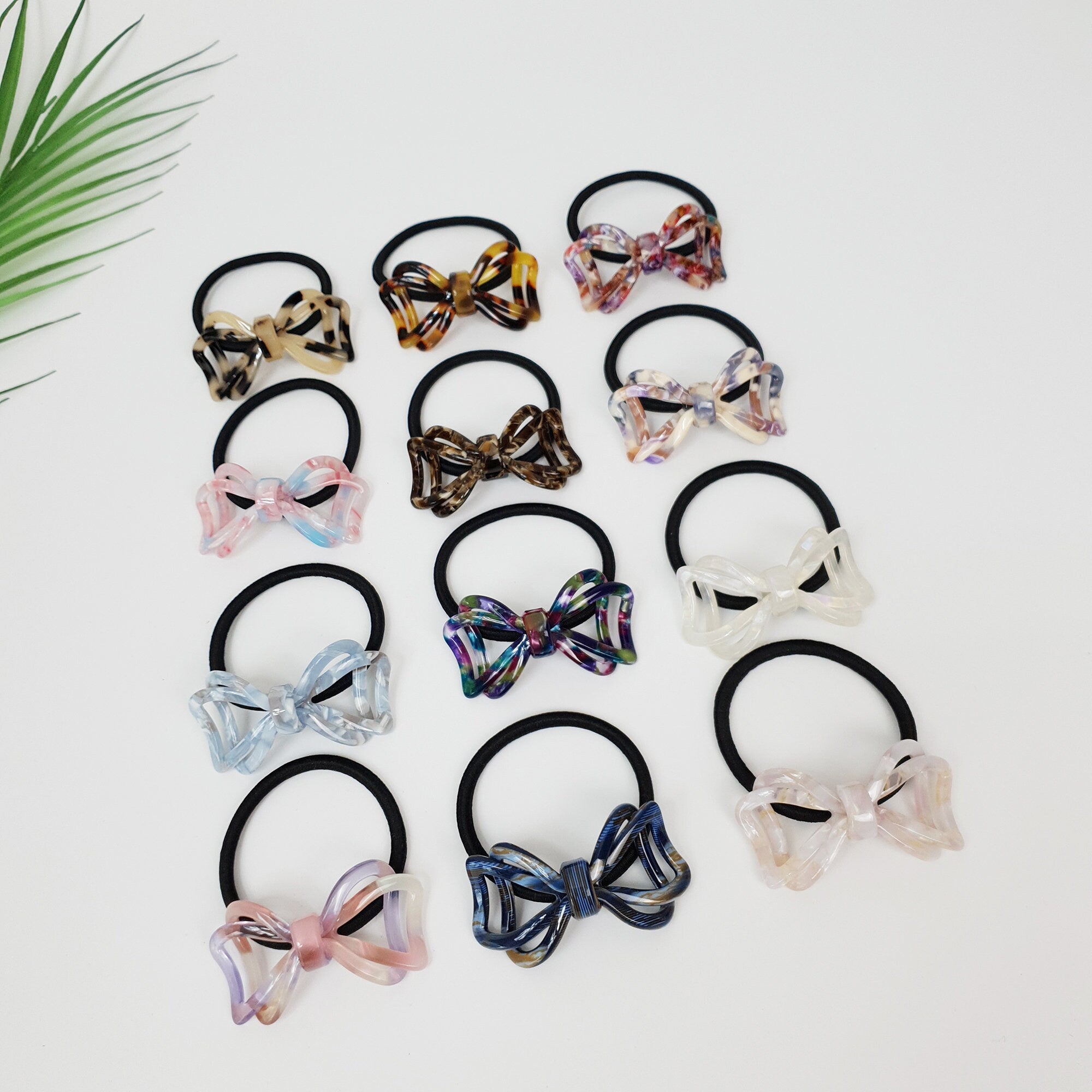 Glossy cellulose acetate double triangle hair tie in tortoise shell and marble. Geometric hollow bow ponytail holder 2.2 inch unique charm for women birthday gift. Art deco Korean fashion accessory.