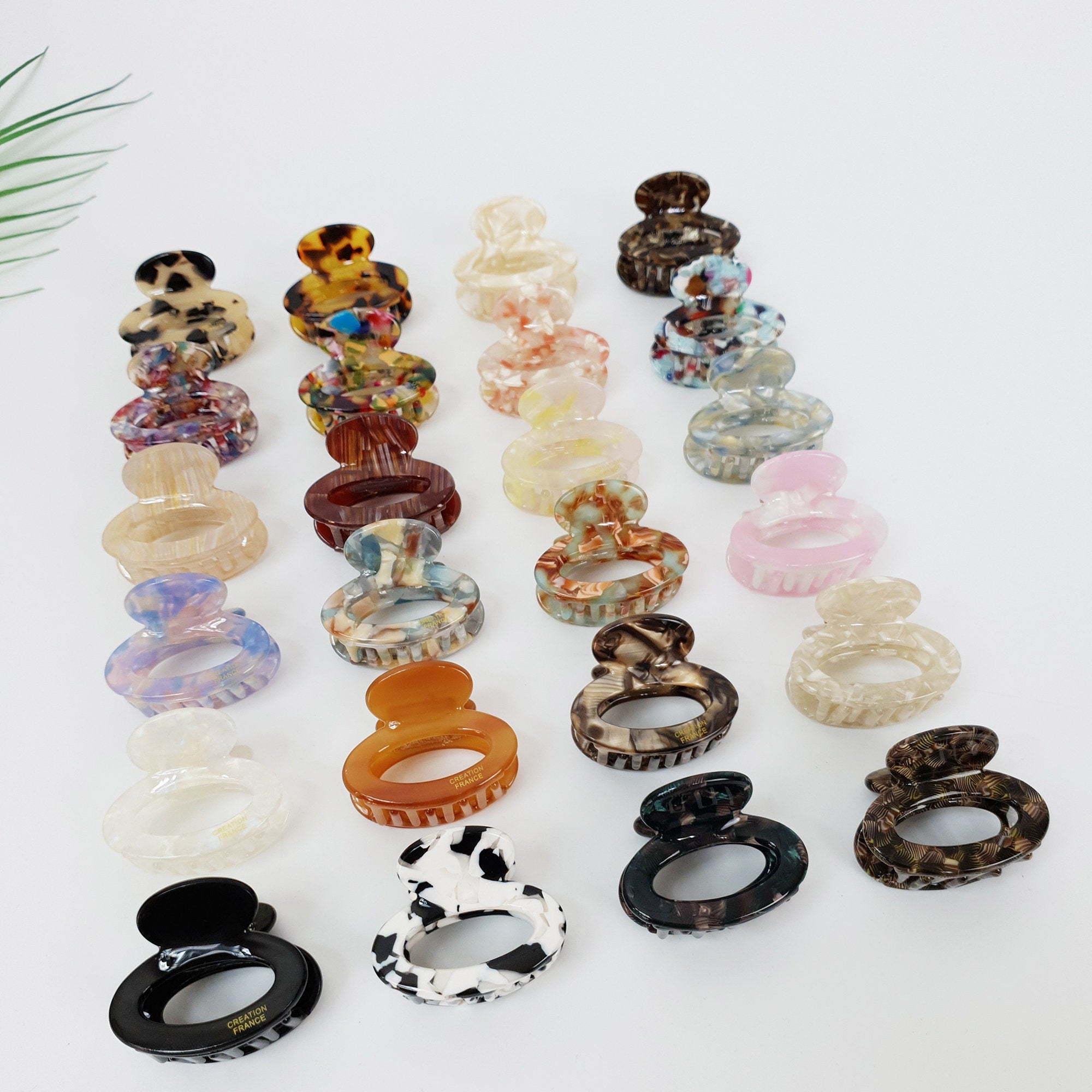 Cellulose acetate mini round hair claw in tortoise and marble patterns. 1.6 inch small jaw clip for bangs and side hair.