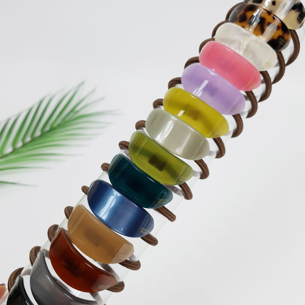 Acetate slim oval ponytail holder in tortoise shell and solid colors. Minimalist Korean geometric hair tie for women.