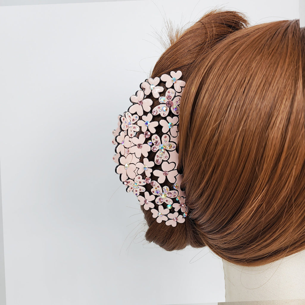 Large pastel hair claw clip 4.9 inch with crystal flower design for thick hair updos and elegant wedding guest styles. A pink flower hair clip with rhinestones. The clip is made of plastic and has a cluster of pink flowers with rhinestones in the center of each flower.