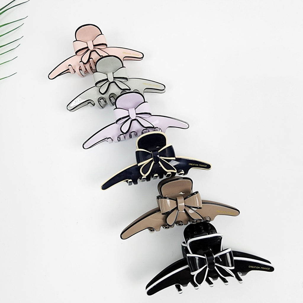 Cellulose acetate long slim hair claw clip with bow design in pastel colors for half-up styling