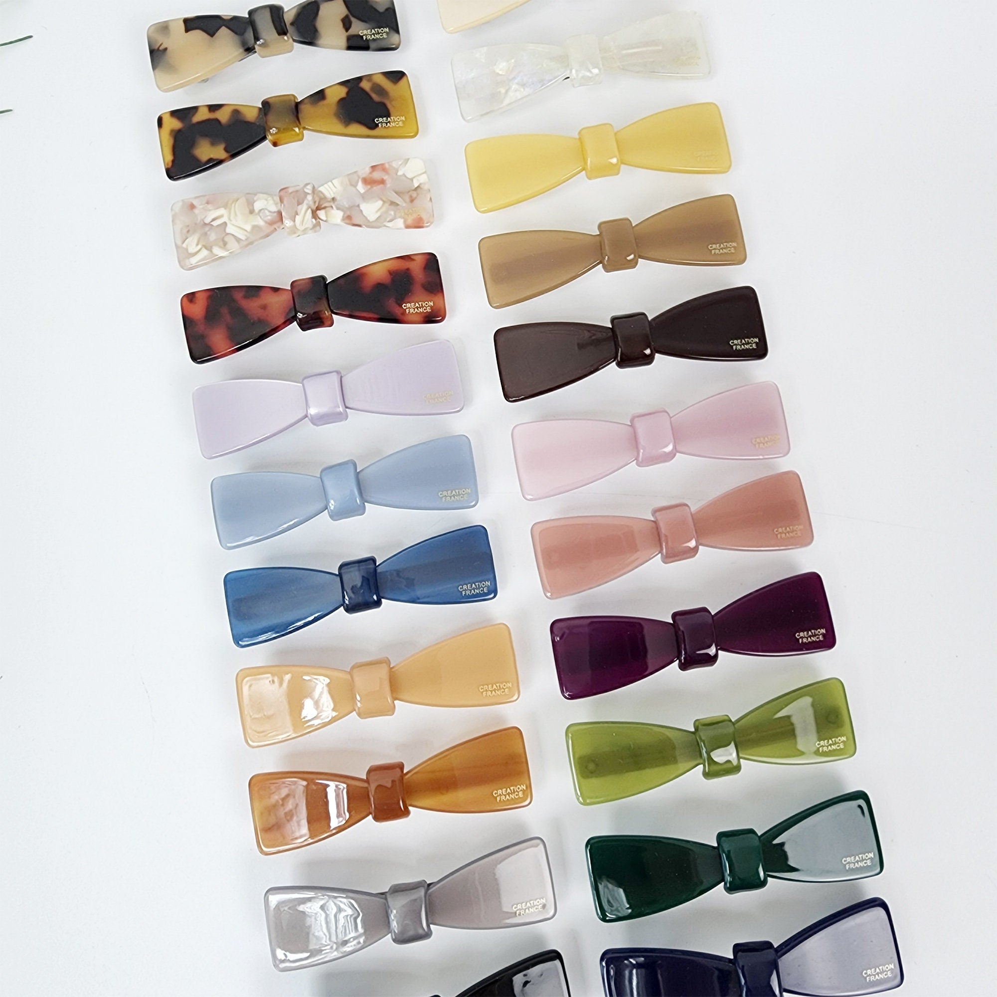 Small cellulose acetate ribbon bow barrette. Mini automatic French clip for side bangs. Glossy tortoise shell and pastel hair accessories gift.