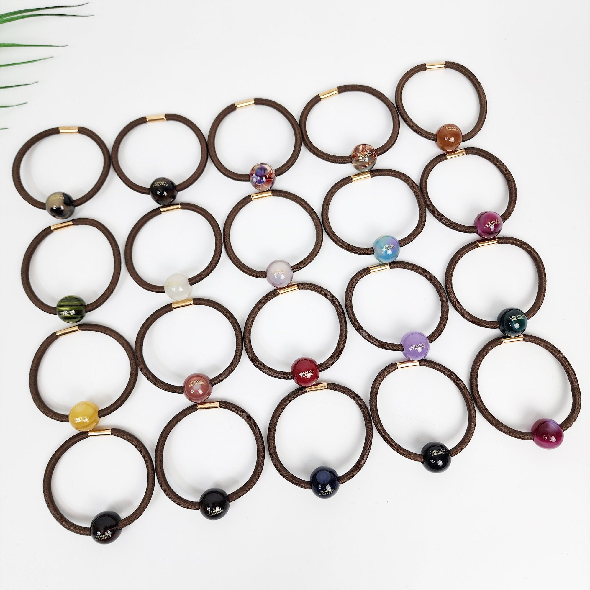 Glossy cellulose acetate mini ball hair ties in tortoise shell pearl and solid colors. Small round bead ponytail holder 0.6 inch minimalist charm for toddler girls and women. Simple Korean fashion accessory birthday gift.