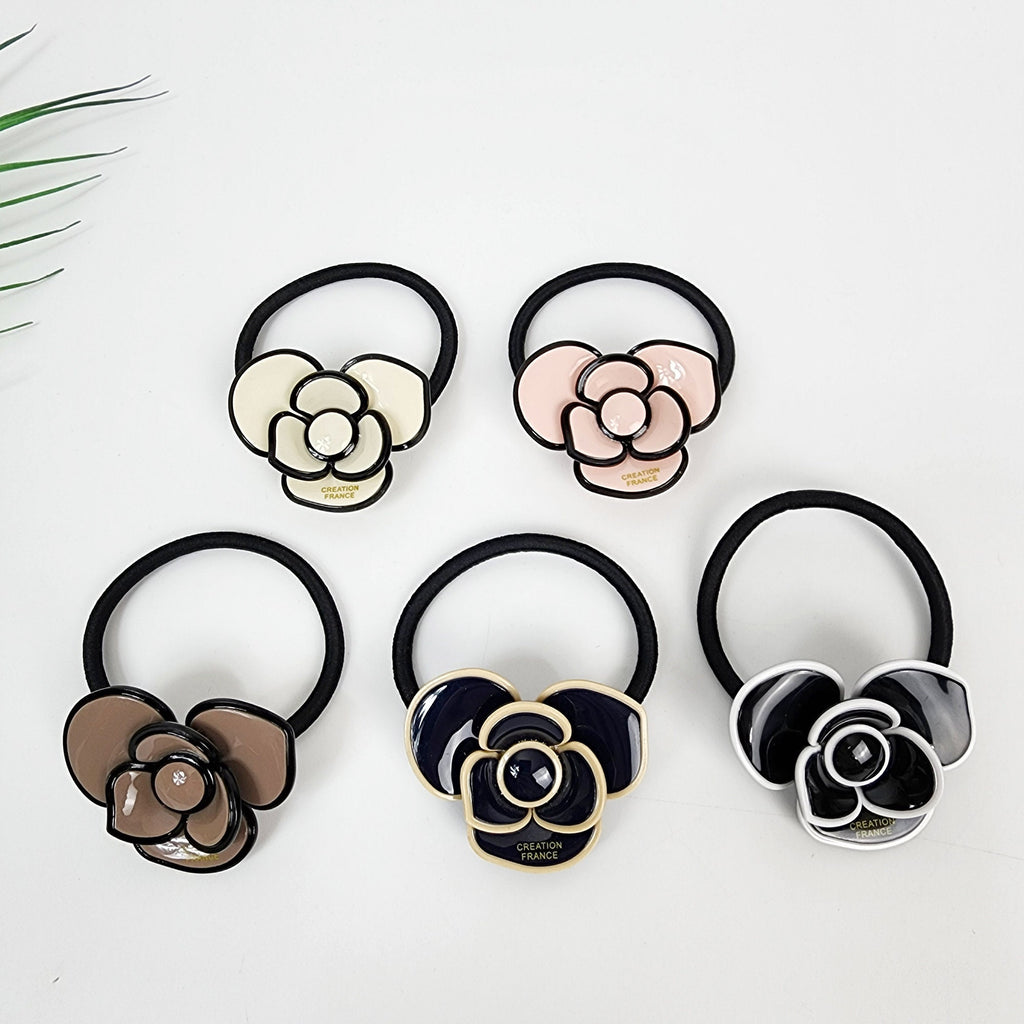 Glossy cellulose acetate camellia flower hair tie. Elegant pastel botanical ponytail holder with black elastic band for women birthday gifts. Korean fashion accessory.