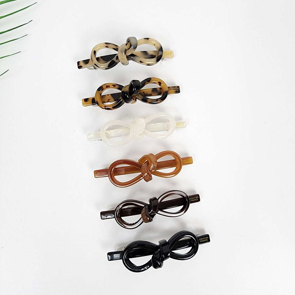 Cellulose acetate bow hair barrette, tortoise shell ribbon clip, elegant automatic hair clasp for women, minimalist ponytail holder, brown and beige hair accessory.