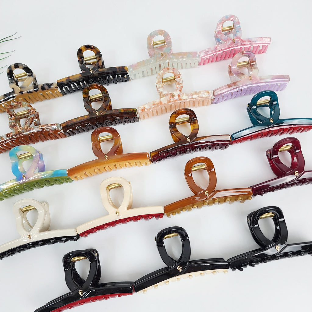 Medium cellulose acetate hair claw clip with U-shaped twist handle. Strong 3.5 inch jaw clip for buns and half updo styling.