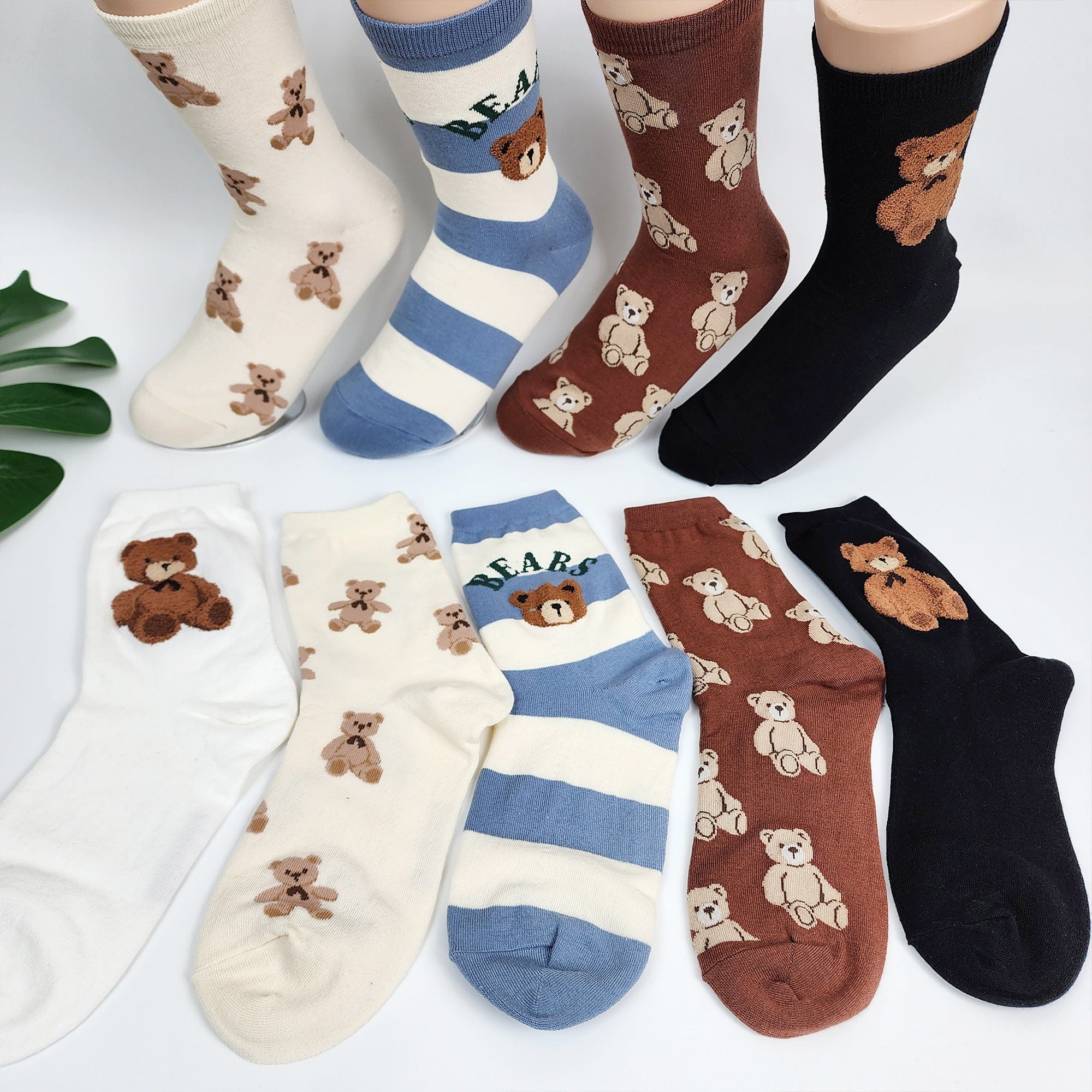 ✨ Multiple Teddy Bear Cotton Crew Socks
Add a playful touch to your daily look with these adorable socks featuring a repeating teddy bear pattern. Crafted from a soft and sturdy cotton blend, they offer a "toktok" (substantial and quality) feel that keeps your feet comfortable all year round. Available in five charming colors—White Ivory, Oatmeal, Sky Blue, Brown, and Black—these mid-calf socks are the perfect mix of cute style and everyday practicality.