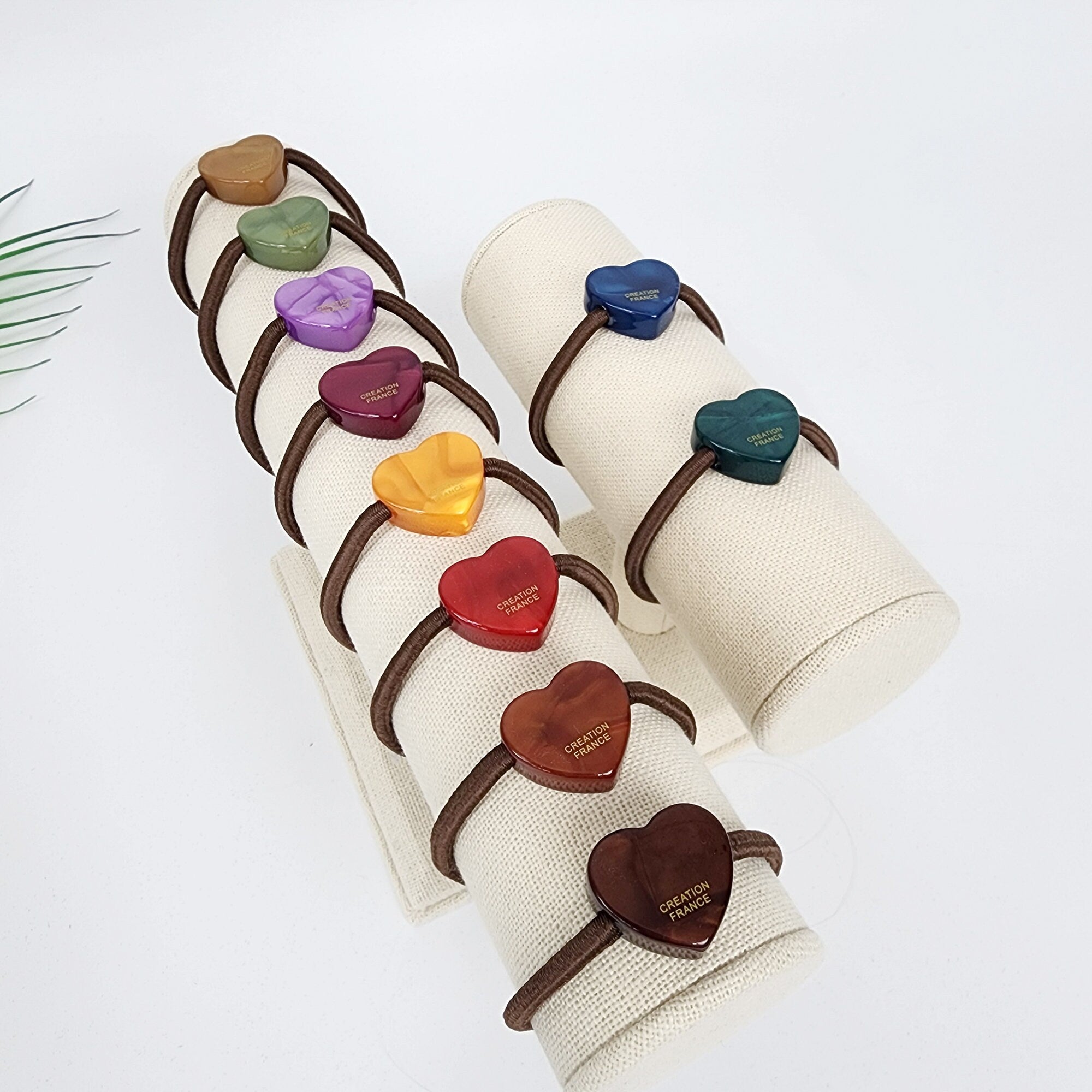 Small heart shaped hair tie in cellulose acetate with aurora finish, mini love charm ponytail holder with durable elastic band, cute minimalist accessory for women and girls.