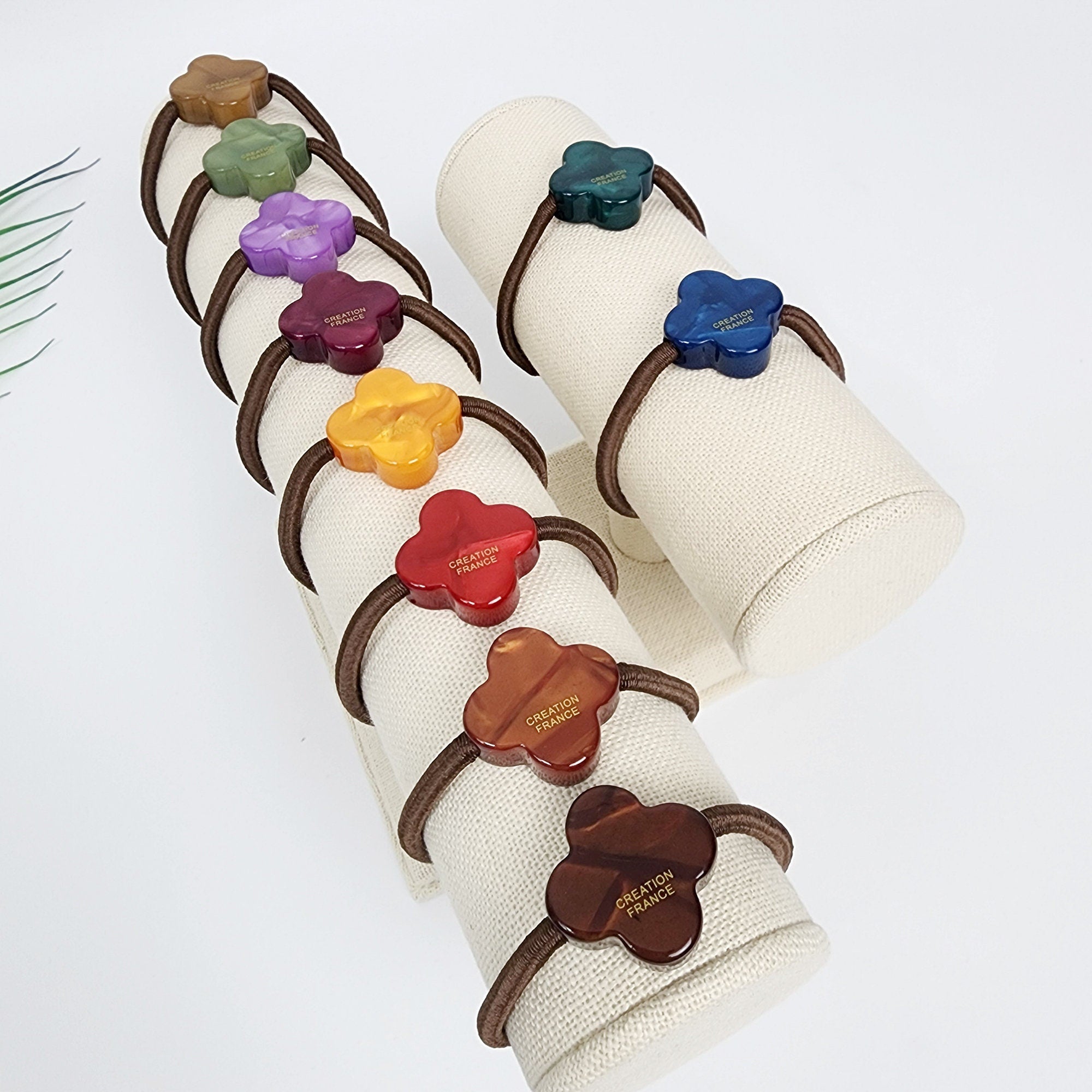 Cellulose acetate clover hair tie in jade green, minimalist four leaf flower ponytail holder, cute lucky charm accessory for birthday gifts.