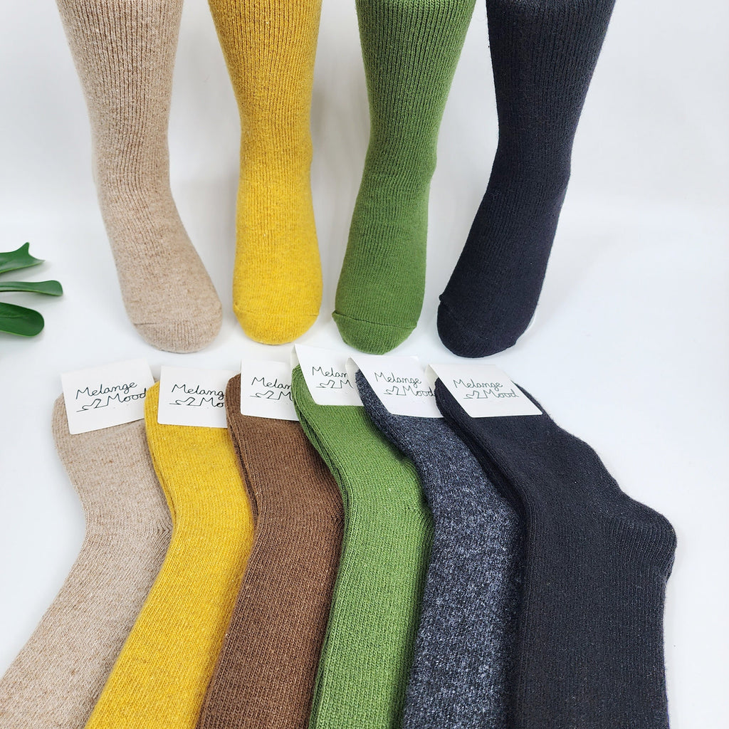 ✨ Warm Marled Wool Crew Socks
Beat the chill with these thick, premium wool blend socks featuring a classic marled (bokashi) texture. Designed for superior warmth, they are the perfect remedy for cold feet or for expectant mothers needing extra coziness. Available in six earthy tones—Beige, Mustard, Brown, Olive Green, Charcoal, and Black—these mid-calf socks are a versatile winter staple for boots or lounging at home.