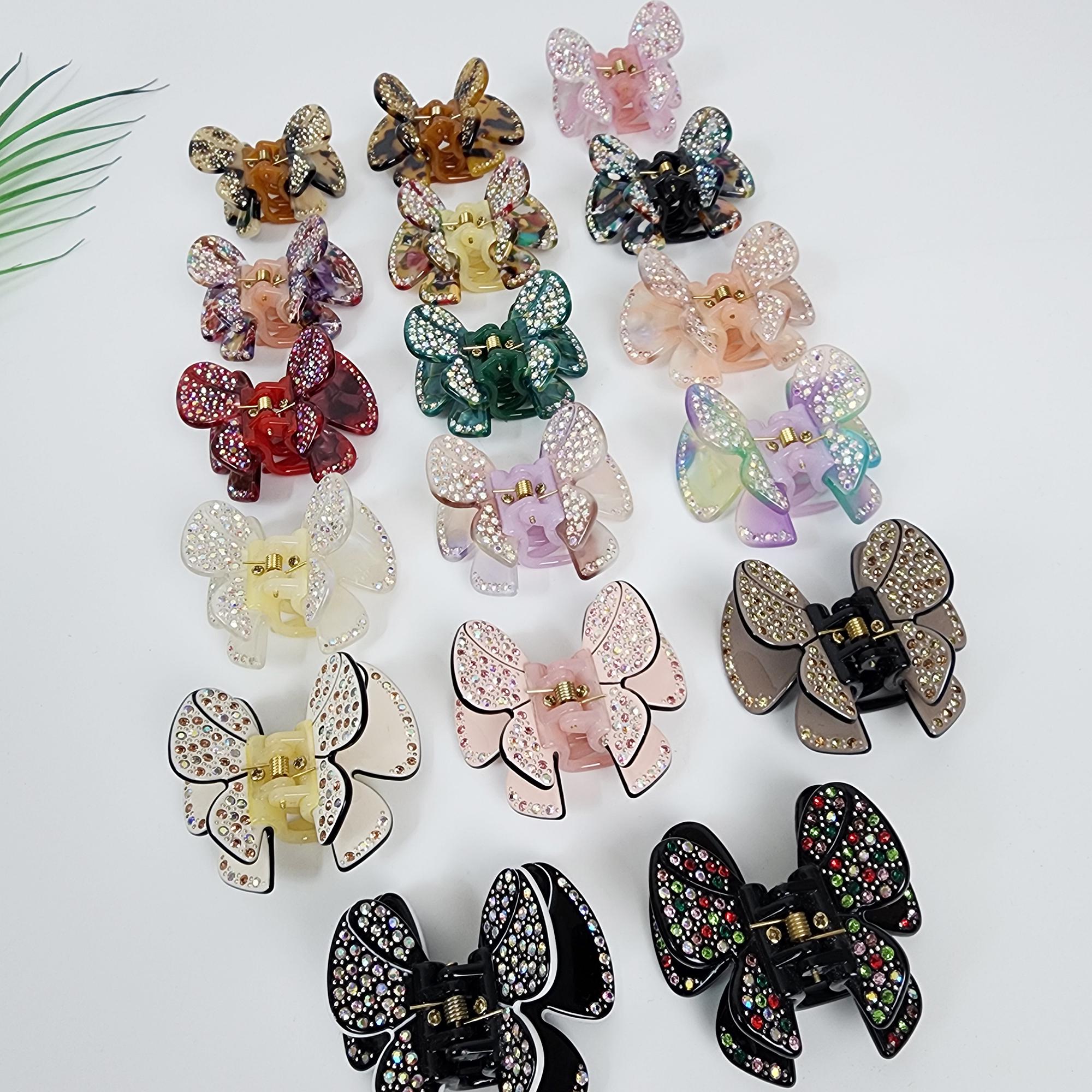 Butterfly shaped cellulose acetate hair claw clip embellished with sparkling rhinestones. Small 2.4 inch crystal double wing jaw clip for half-up hairstyles.