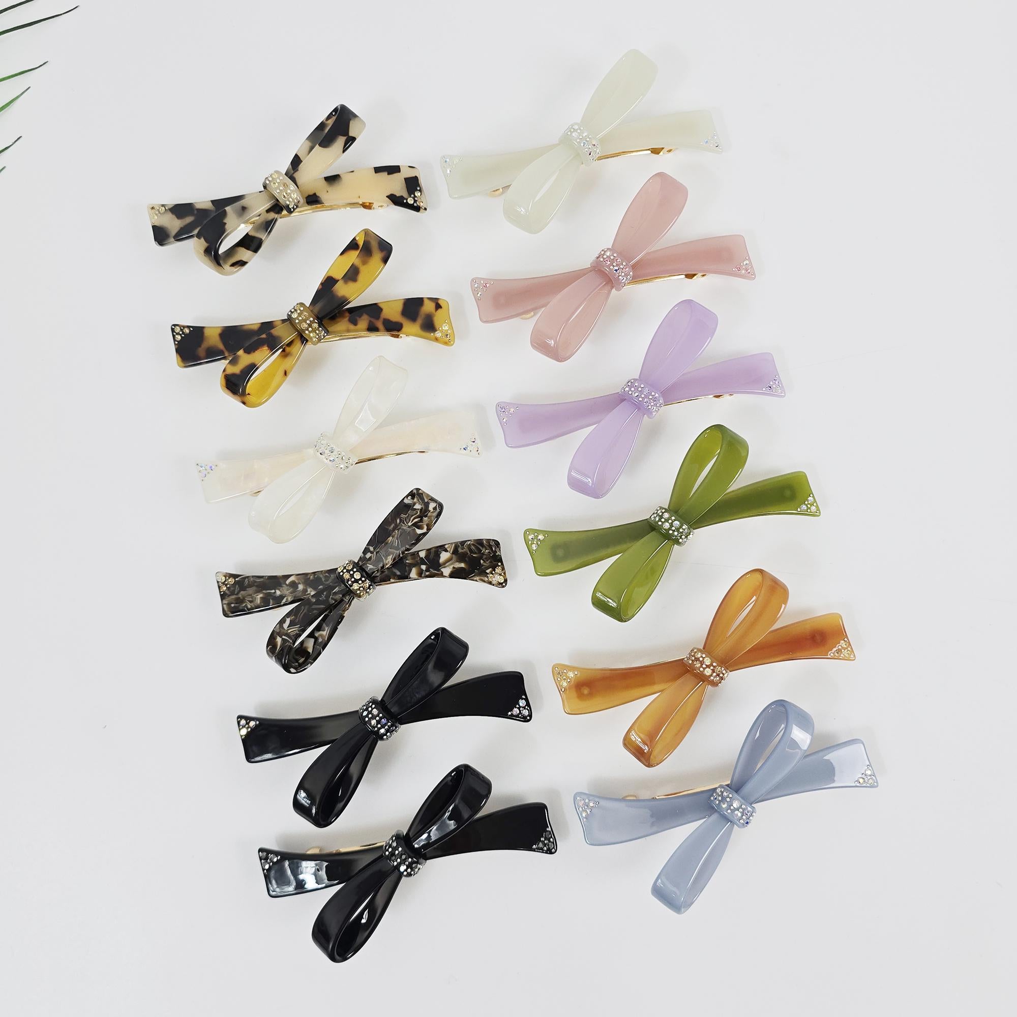 Cellulose acetate bow hair barrette with rhinestone center knot. 3.7 inch tortoise shell and pastel ribbon clip for side hair and half up styles.