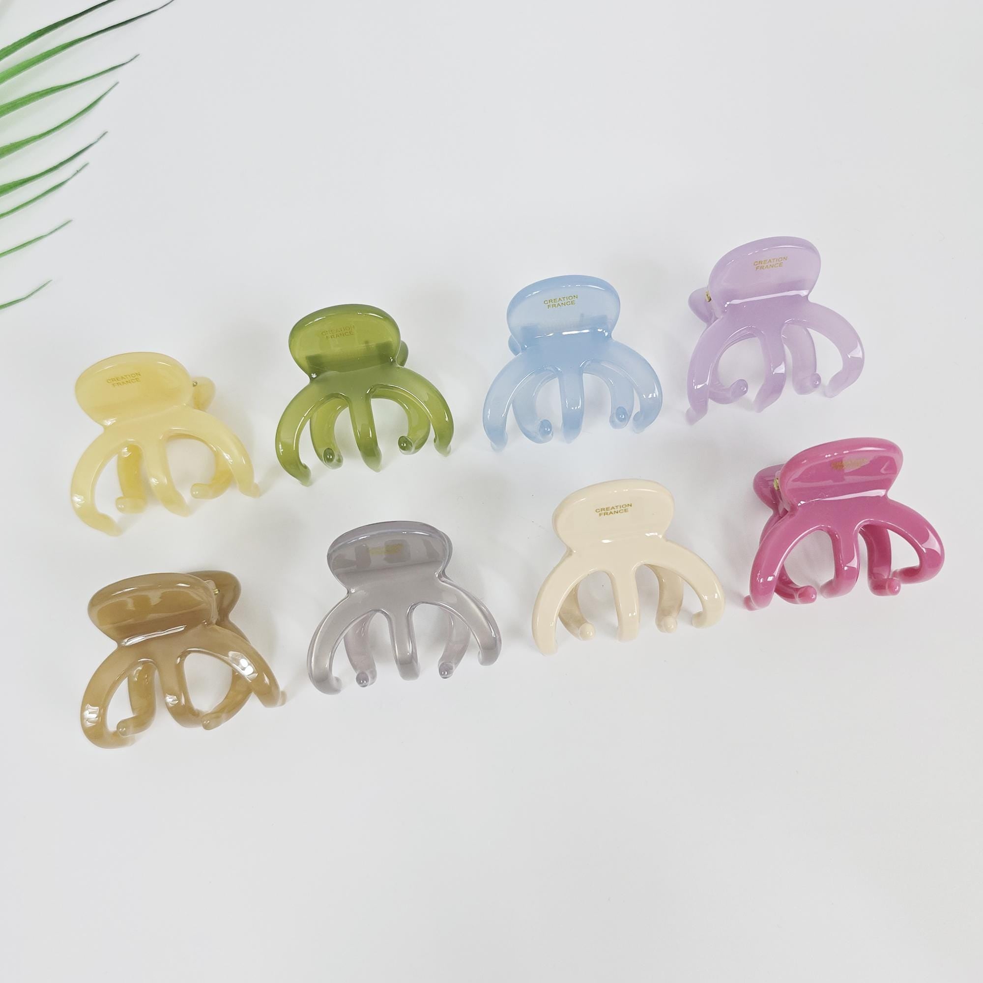 Cellulose acetate five-prong mini claw clips in pastel colors for half up hairstyles and secure grip.