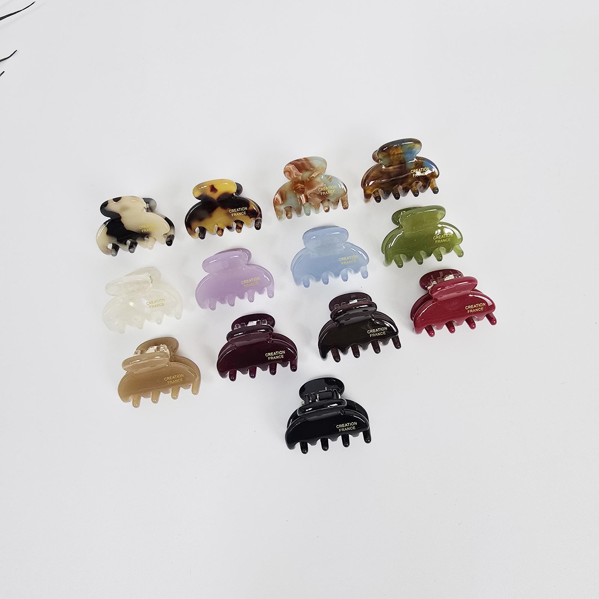 Cellulose acetate mini claw clips in tortoise shell and pastel colors for half up hairstyle and bangs.
