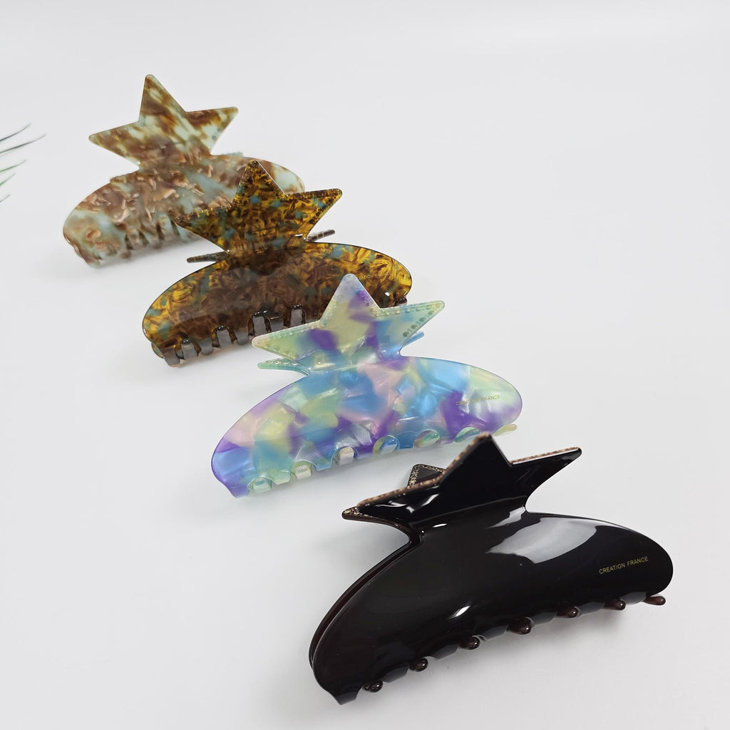 Large star shaped cellulose acetate hair claw clip with rhinestone embellishments. 12cm glossy jaw clip for updos. Tortoise and aurora color celestial hair accessory.