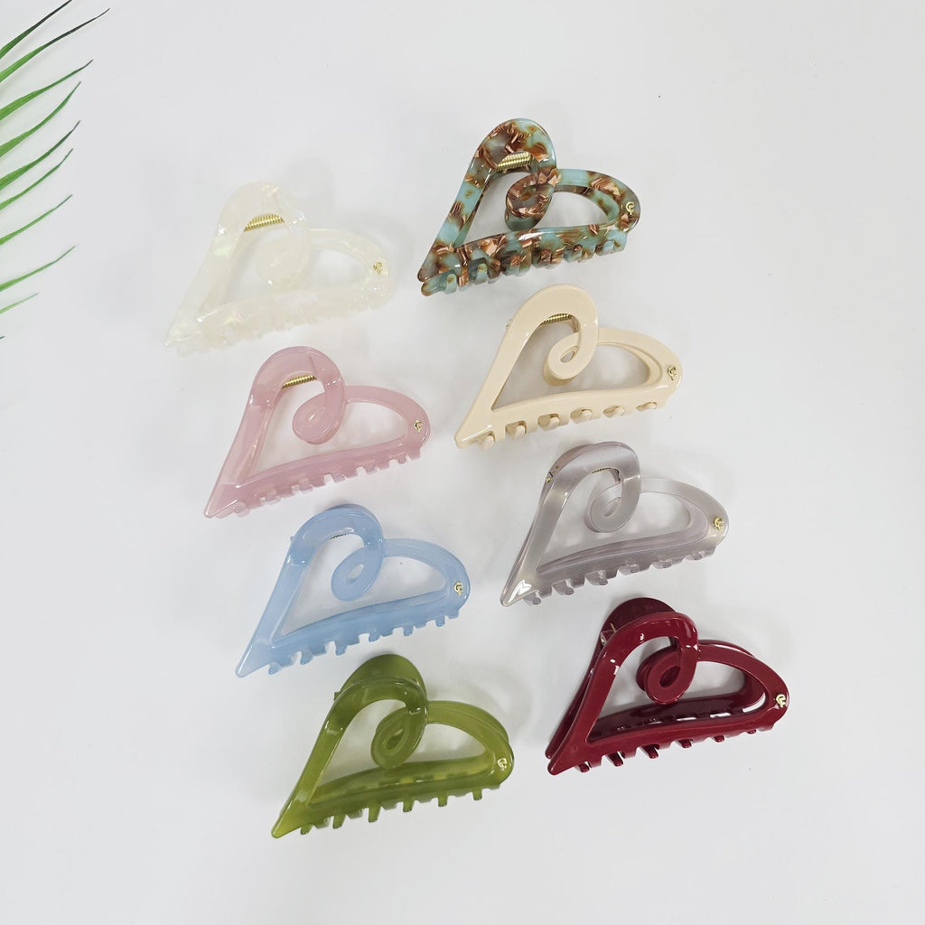 Glossy cellulose acetate heart shaped hair claw clip. 9cm medium jaw clip in pastel and tortoise colors. Romantic half-up hair accessory for women.
